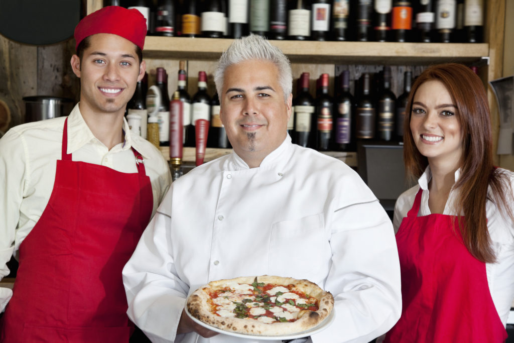 Happy chef with his team